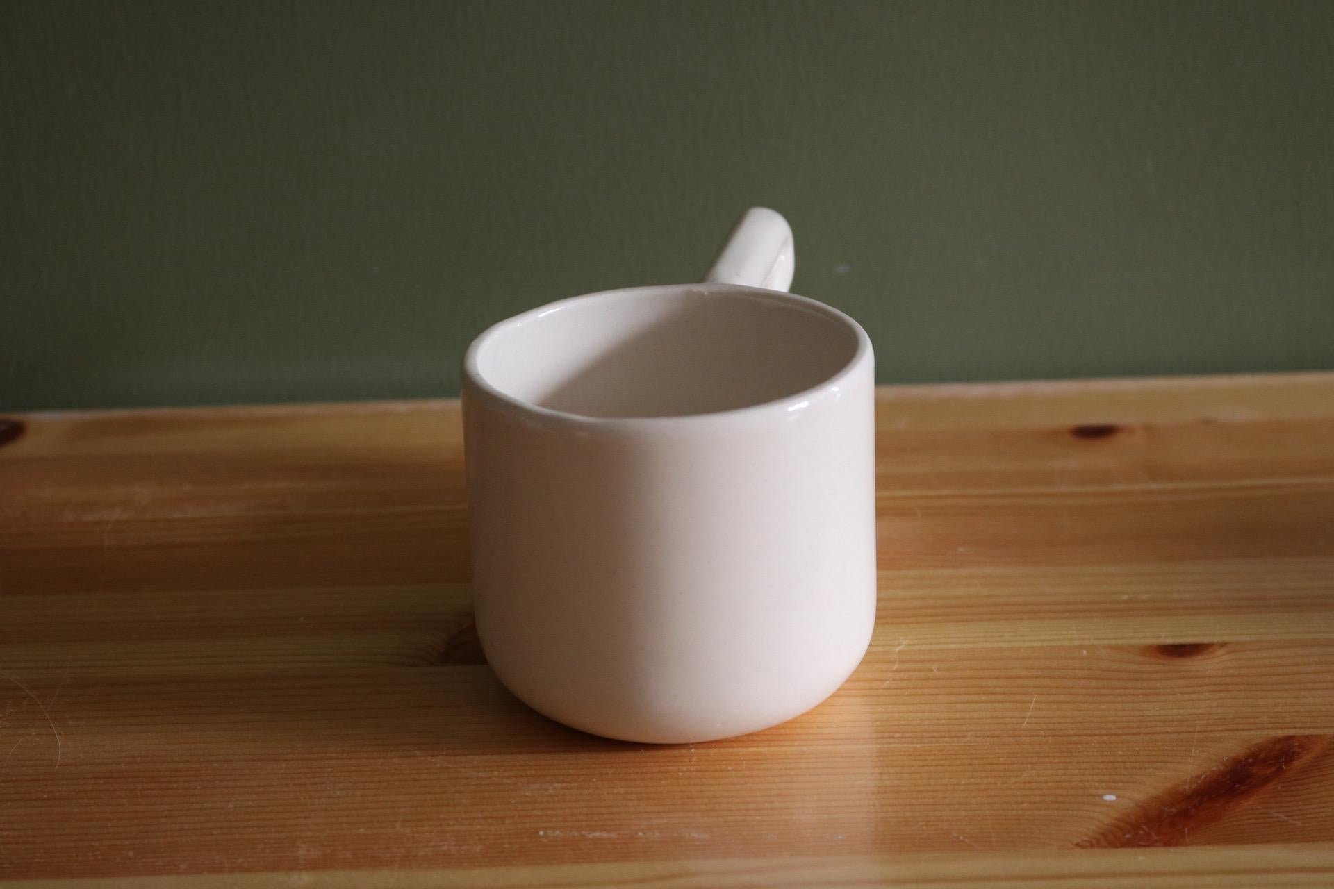 Handmade Porcelain Coffee Mug: Unique Wavy Handle, Modern Ceramic Cup