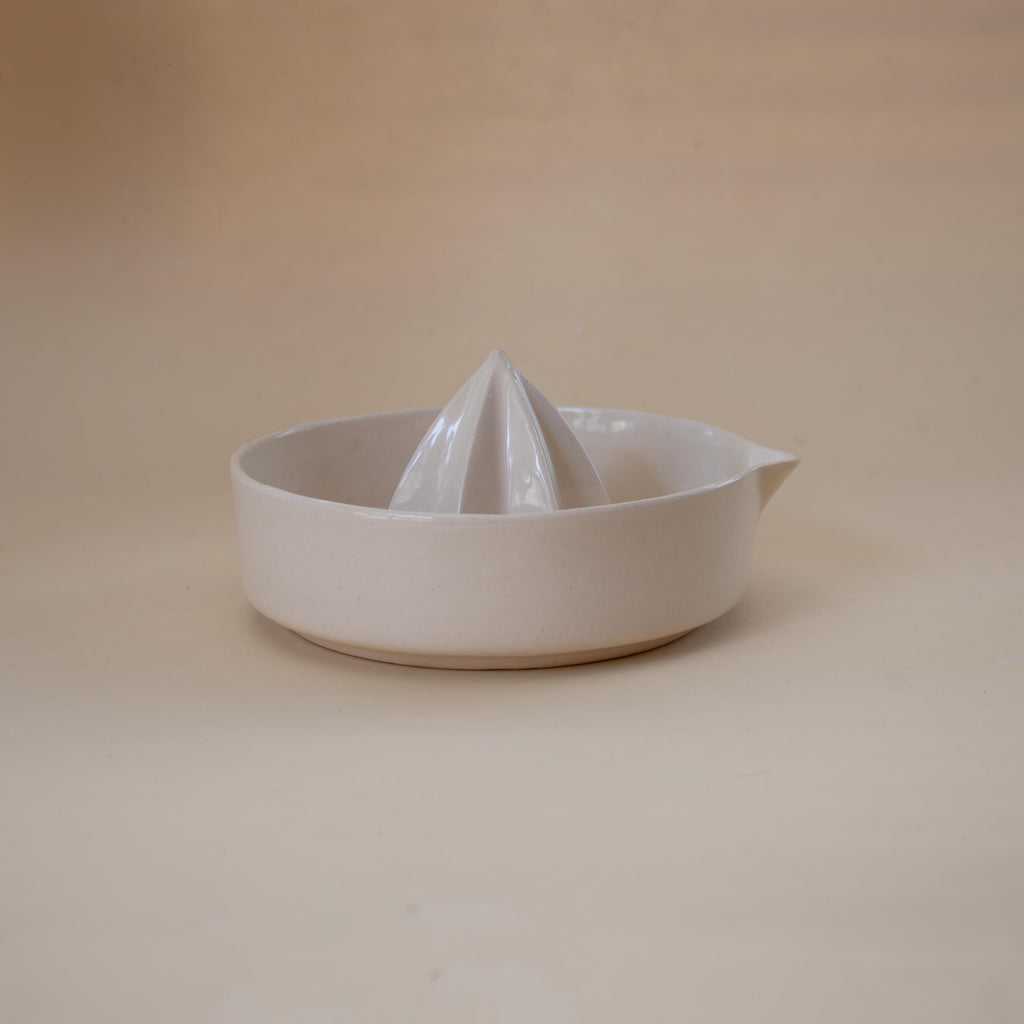 Handmade ceramic lemon squeezer with star-shaped reamer, minimalist artisan citrus juicer