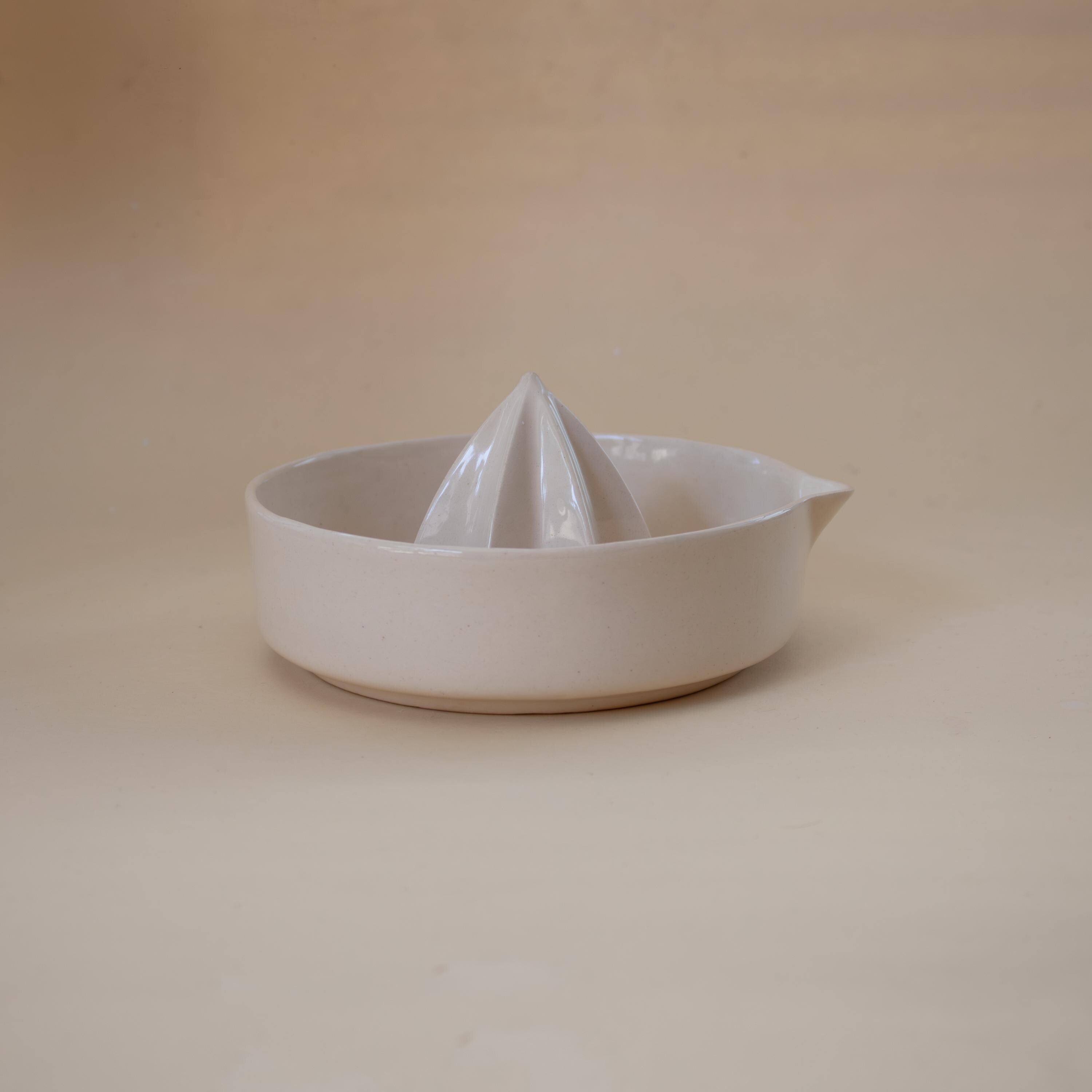 Handmade ceramic lemon squeezer with star-shaped reamer, minimalist artisan citrus juicer