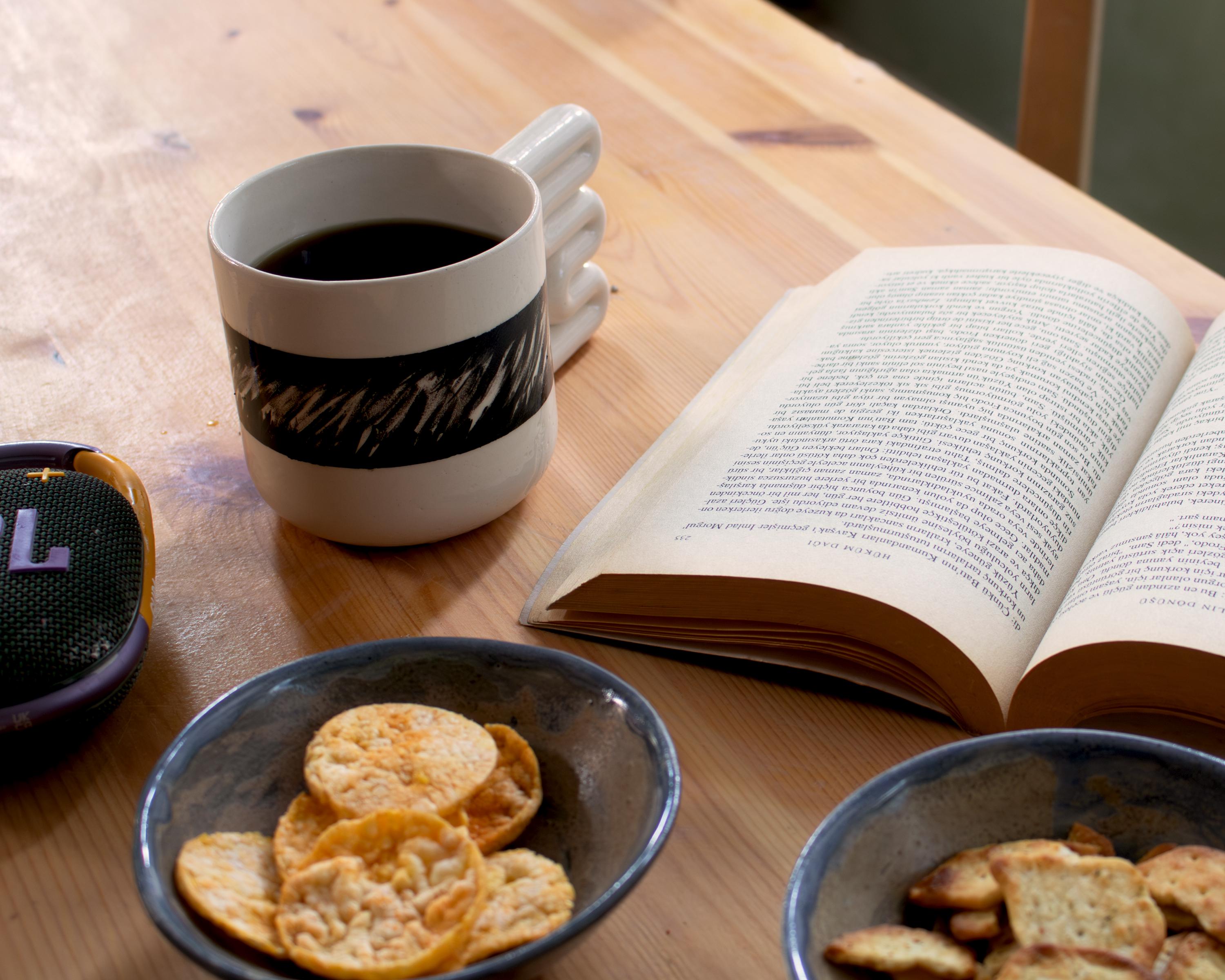 Handmade Porcelain Coffee Mug: Wavy Handle, Black & White Ceramic