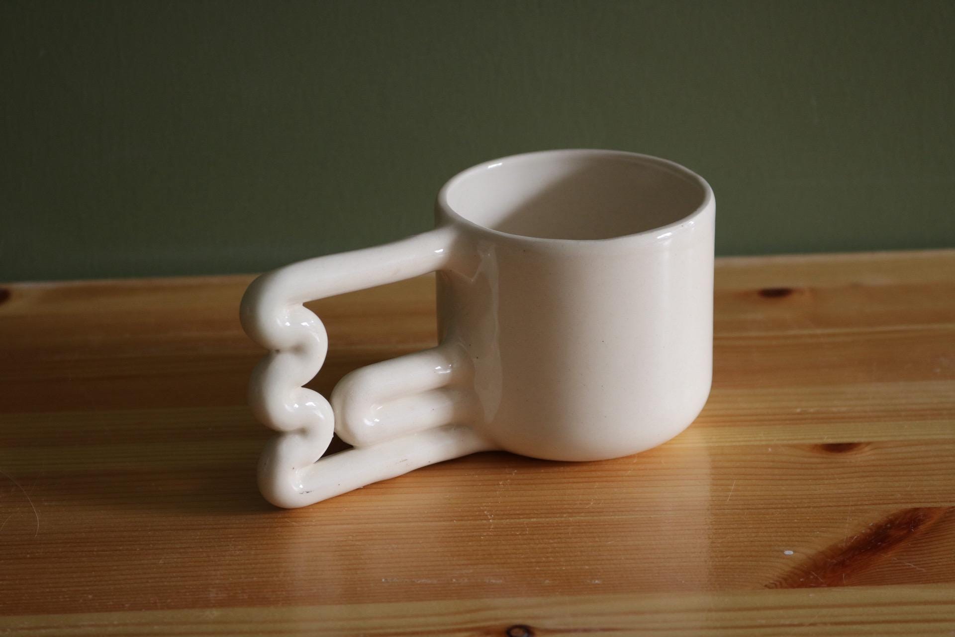 Handmade Porcelain Coffee Mug: Unique Wavy Handle, Modern Ceramic Cup