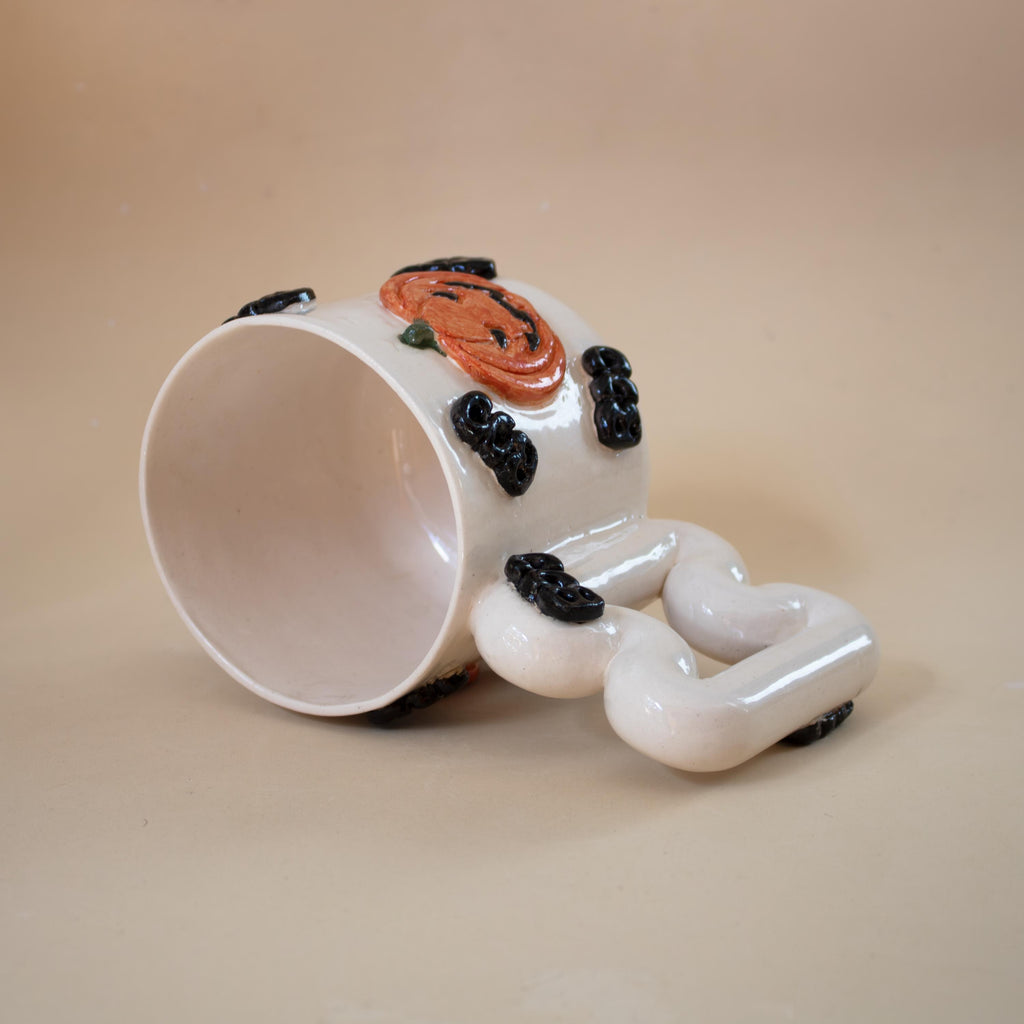 Halloween pumpkin porcelain mug with funky handle: spooky coffee cup