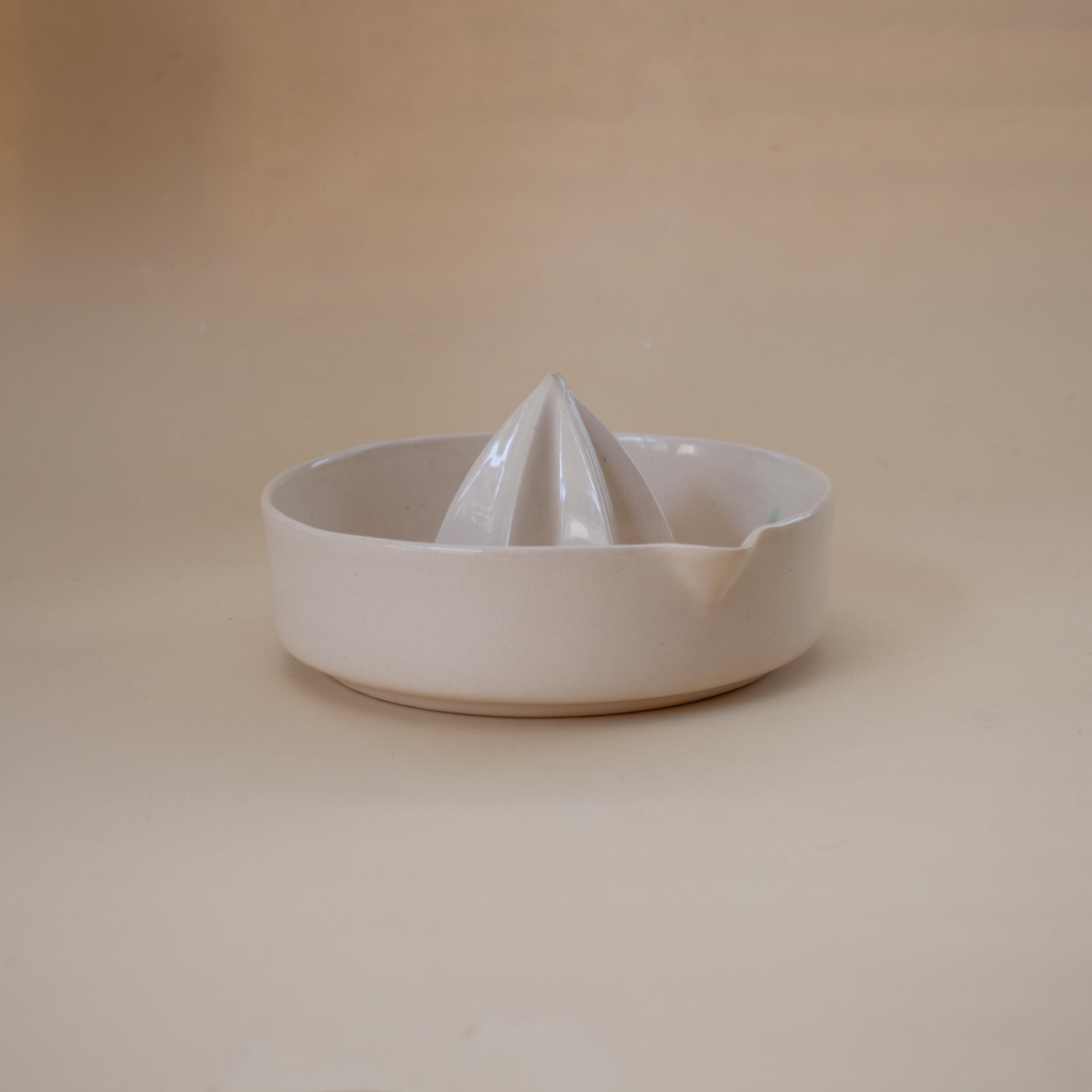Handmade ceramic lemon squeezer with star-shaped reamer, minimalist artisan citrus juicer