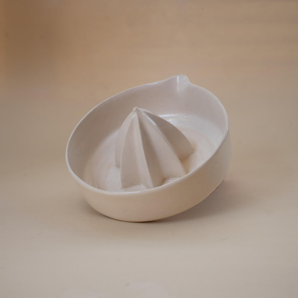 Handmade ceramic lemon squeezer with star-shaped reamer, minimalist artisan citrus juicer