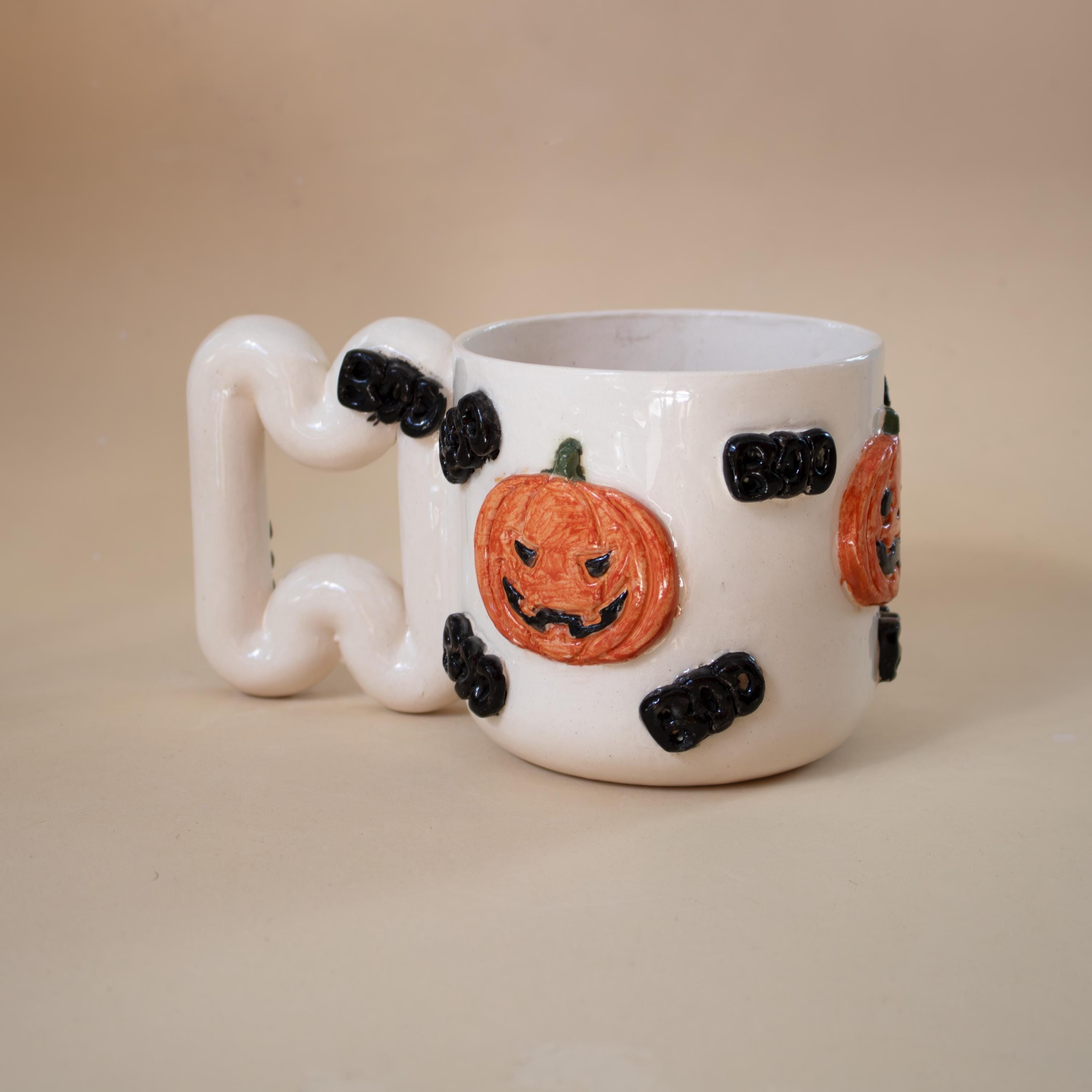 Halloween pumpkin porcelain mug with funky handle: spooky coffee cup