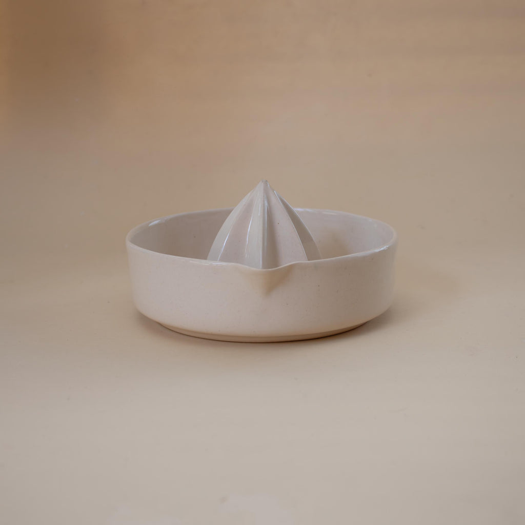 Handmade ceramic lemon squeezer with star-shaped reamer, minimalist artisan citrus juicer