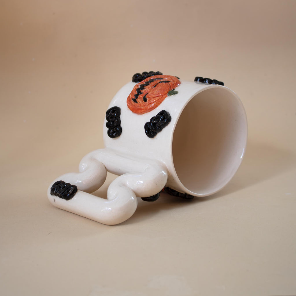 Halloween pumpkin porcelain mug with funky handle: spooky coffee cup
